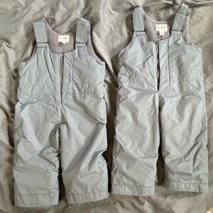 Place bundle of two gray snow pants